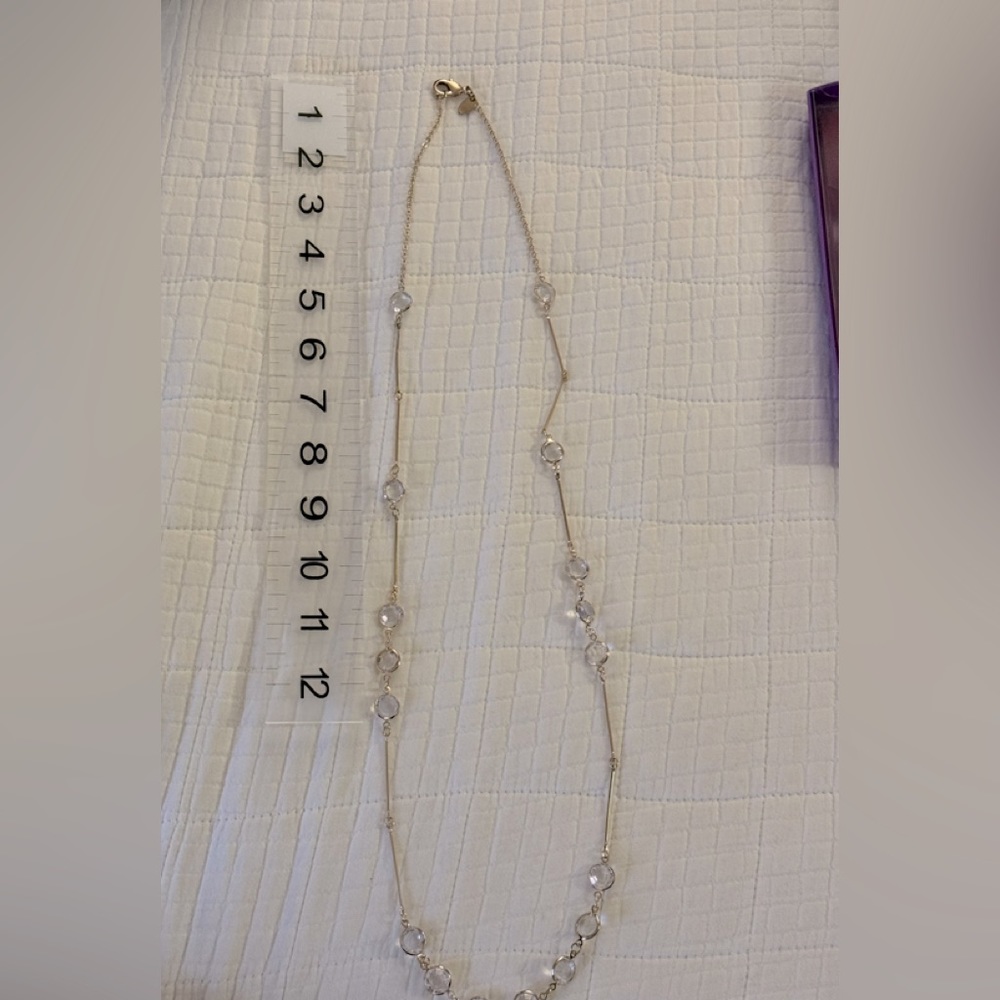 Long gold necklace
